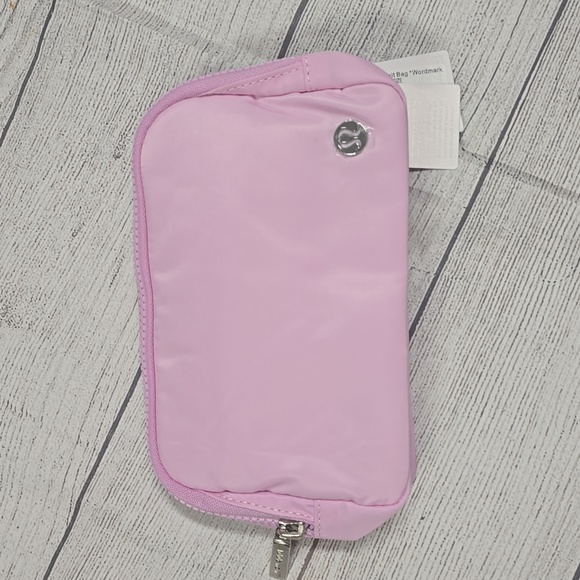 NWT Lululemon Everywhere Wordmark Crossbody Belt Bag 1L - Pink/White - Picture 3 of 5